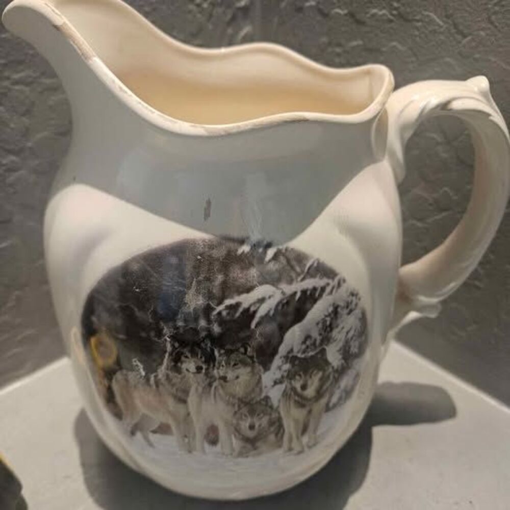 Ceramic Pitcher with Wolves Scene 1 small chip as seen 5" x 10"